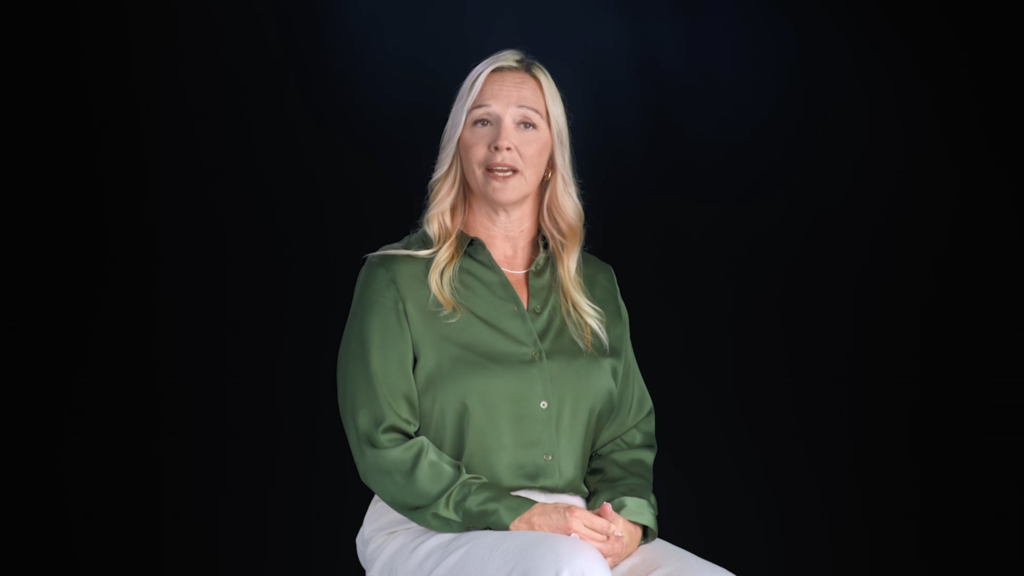 A patient in a green blouse shares her story against a black backdrop, Victoria Park Medispa campaign